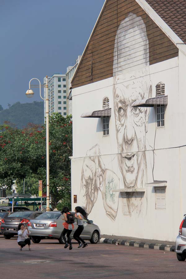 Man drinking coffee - street art in Ipoh.