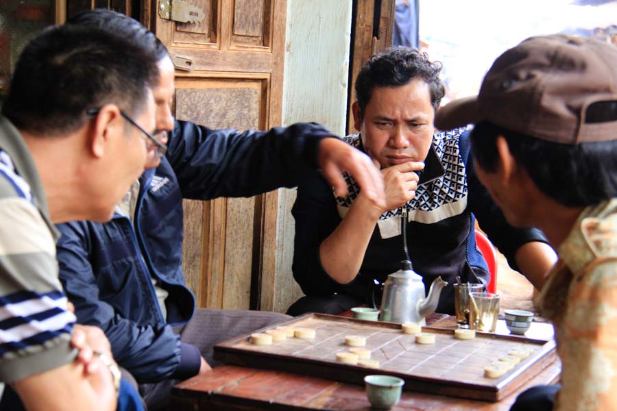 Men playing Chinese chess in Dak Lak, Vietnam